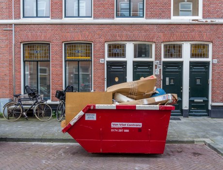 Construction site with builders waste being cleared